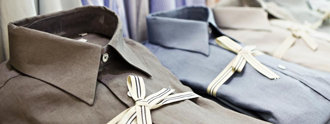 Smart shirts tied with striped ribbon in exclusive menswear store