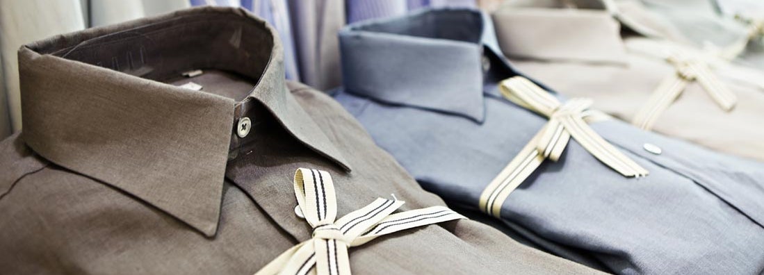Smart shirts tied with striped ribbon in exclusive menswear store