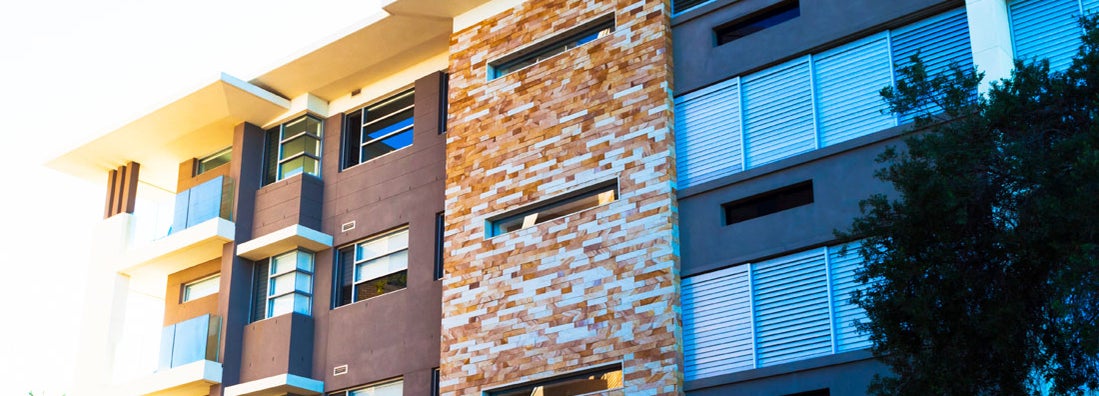 Modern apartment building in dusk sunlight