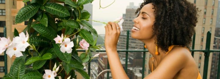 Girl living in the city enjoying her urban garden