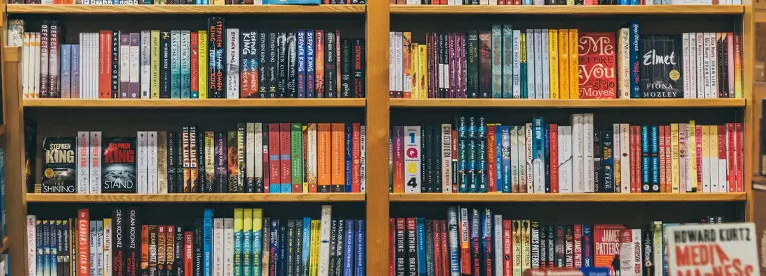 Books on shelves in a bookstore. Find bookstore insurance.