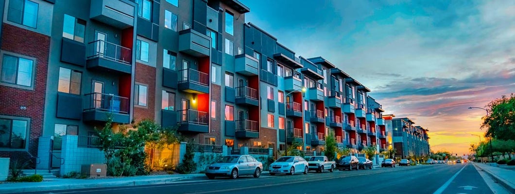 Modern luxury apartments at sunset. Find Arizona Renters Insurance.