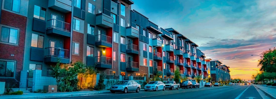 Modern luxury apartments at sunset. Find Arizona Renters Insurance.