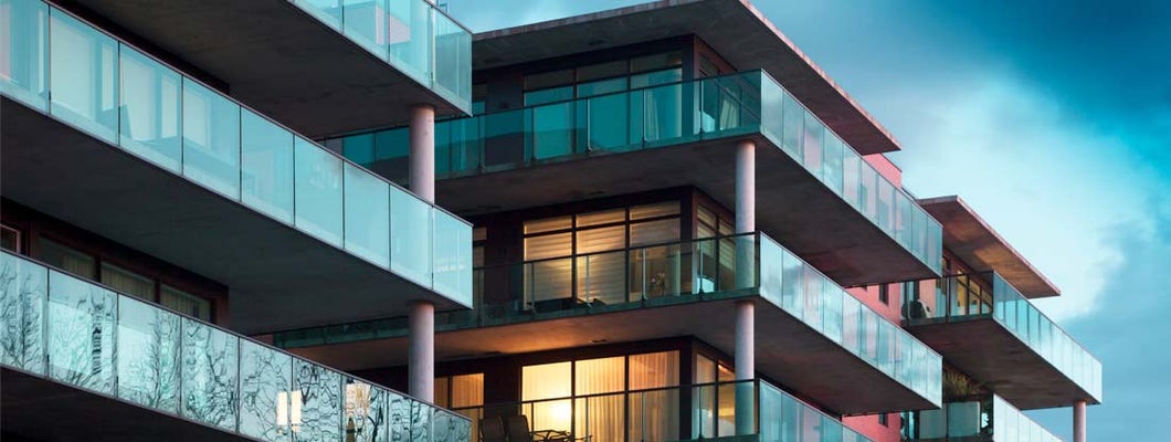 Balconies of a modern luxury apartments with a blue sky. Find Condo association Insurance.