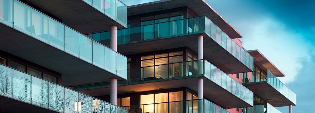 Balconies of a modern luxury apartments with a blue sky. Find Condo association Insurance.