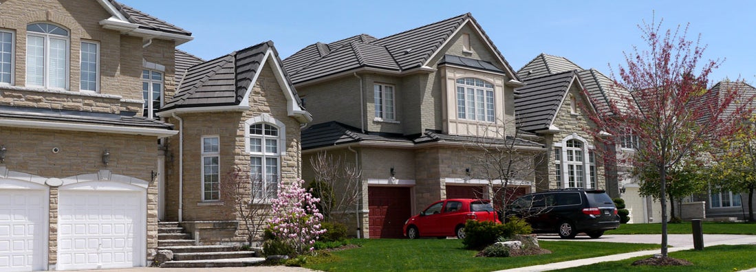 Typical street in a North American - homes with multiple cars