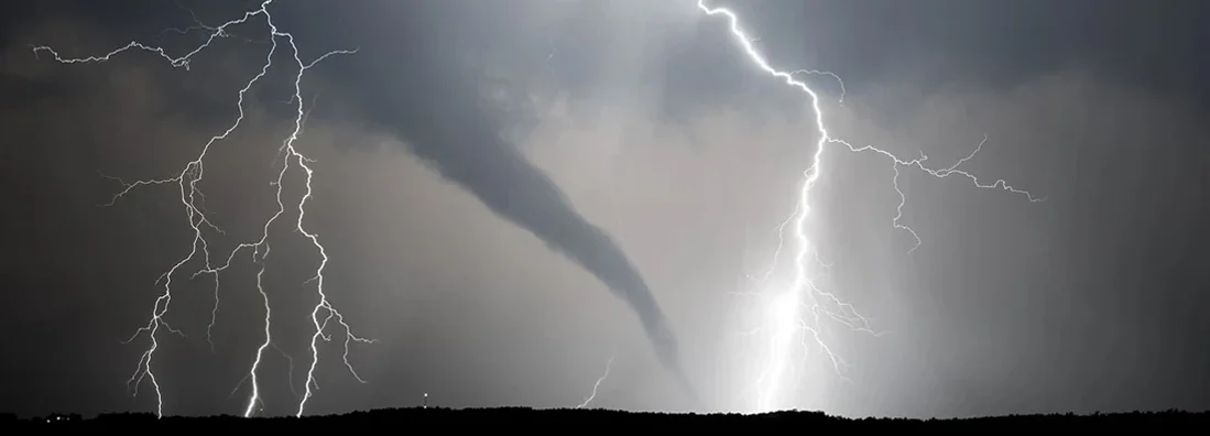 A powerful thunderstorm producing a tornado and lightning. 10 Key Safety Tips to Help You Get Through Tornado Season in Illinois. 