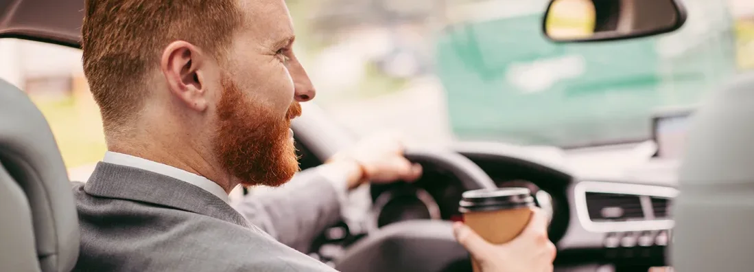 Businessman in car. How to Find the Best Car Insurance Policy in Dunwoody, Georgia.