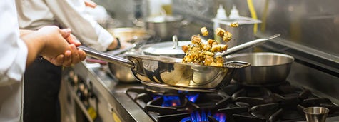 Chef preparing cuisine in restaurant kitchen