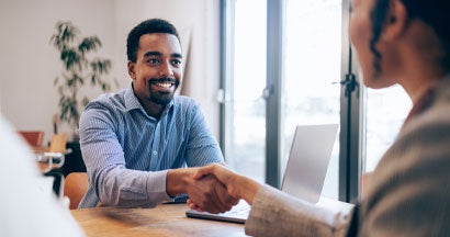 Handshake at a Job Interview. How Do Insurance Agents Make Money?