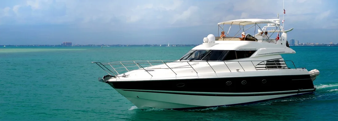 Luxury boat crossing the Biscayne Bay in Miami. Boat Insurance 101.