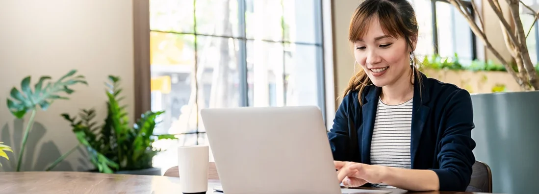 Small business owner working on office desk computer. Snoqualmie, Washington Business Insurance.