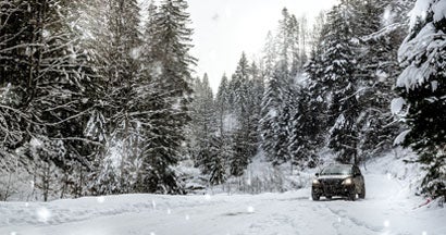 Off road car in the winter forest. 10 Tips for staying safe on the road in the winter.