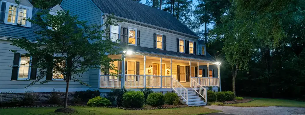 Colonial style house at dusk. Homeowners Insurance in Erie, PA.