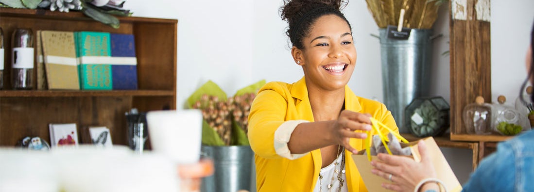 Retail sales woman helping customer