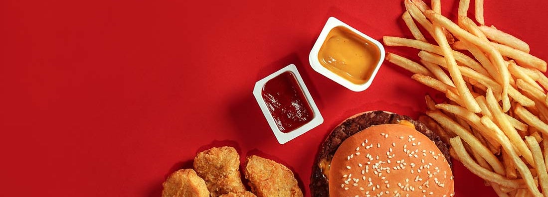 Fast food on red background.  How to insure a fast food restaurant.