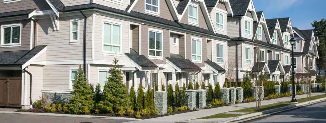 Row of the new townhouses. How to insure a townhouse.