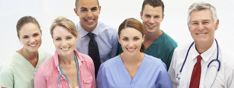 A smiling group of doctors and nurses.