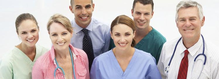 A smiling group of doctors and nurses.