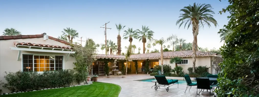 Patio With Pool In Front Of Modern House. Find Lake Mary, Florida home insurance.