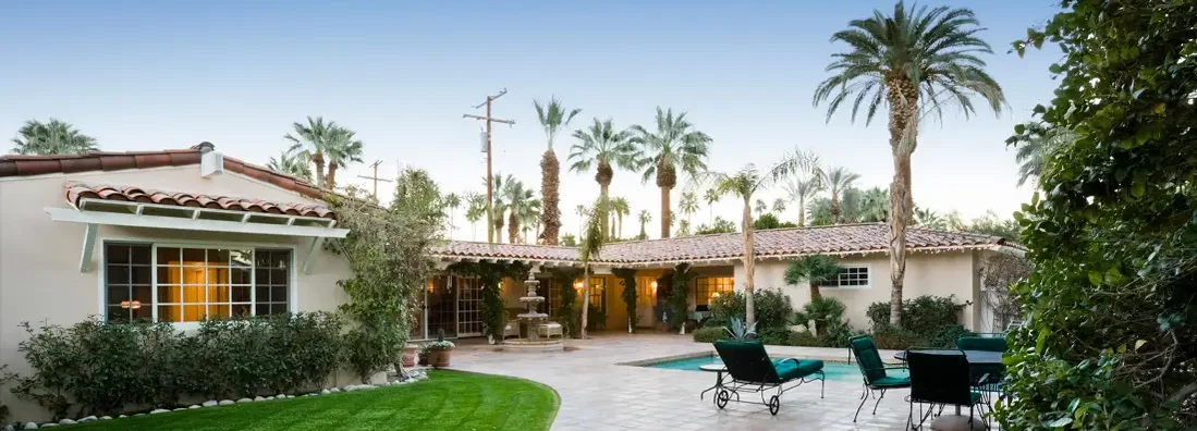 Patio With Pool In Front Of Modern House. Find Lake Mary, Florida home insurance.