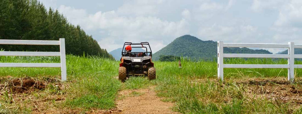 UTV 4-wheel drive in farm. Find UTV Insurance.