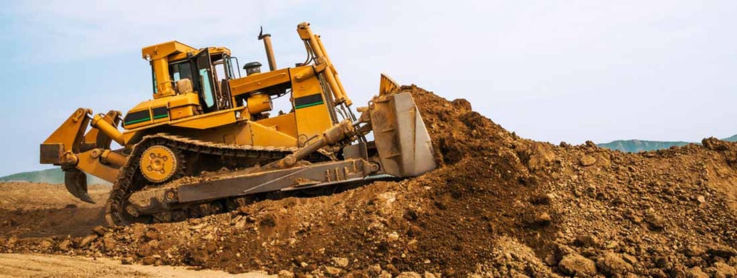 Bulldozer in open field operation. Find Bulldozer Insurance.