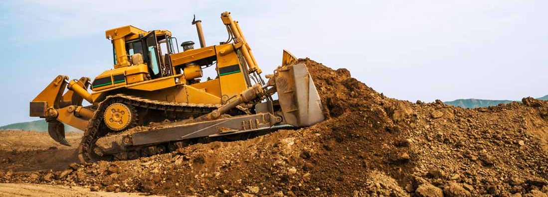 Bulldozer in open field operation. Find Bulldozer Insurance.