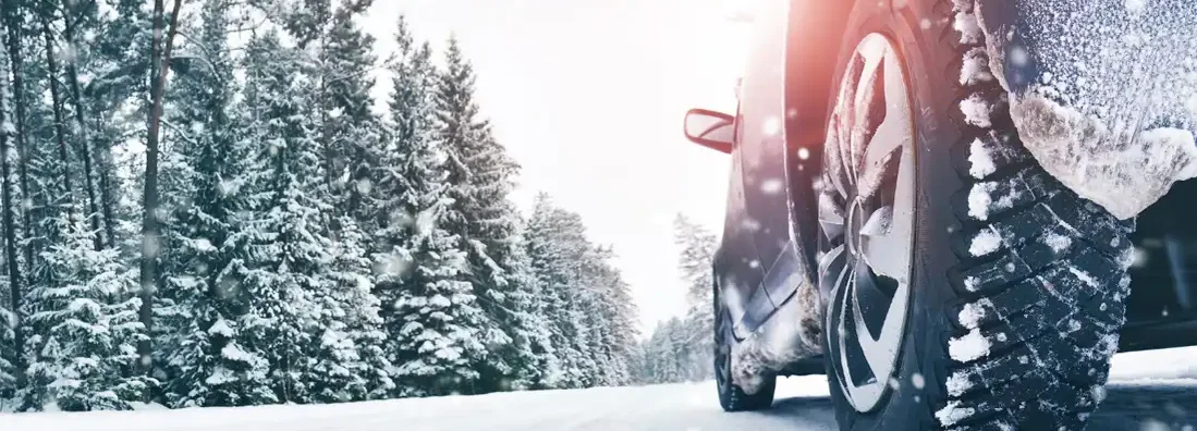 Closeup of car tires in winter on the road. Best winter cars and SUVs. 