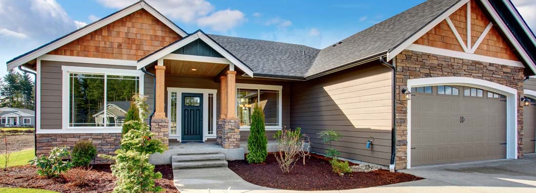 Large modern house with stone and walkway. Find Walpole Massachusetts Homeowners Insurance.