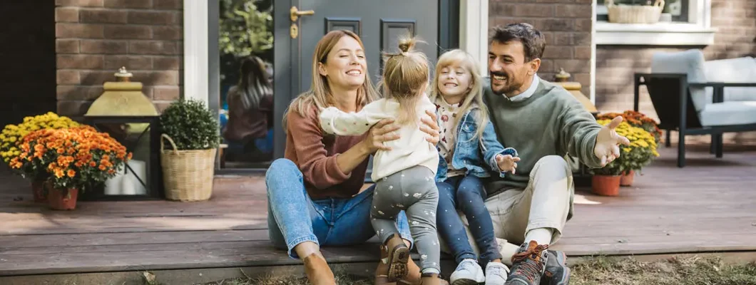 Young family enjoying in sunny day. Find Mississippi Life Insurance.