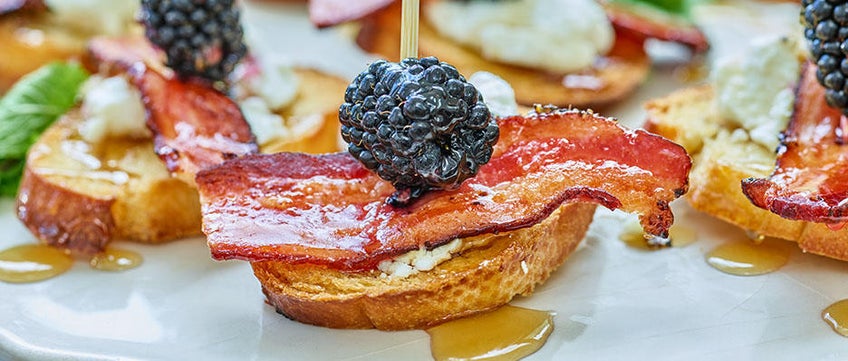 Bacon Crostinis with Goat Cheese, Blackberries and Honey