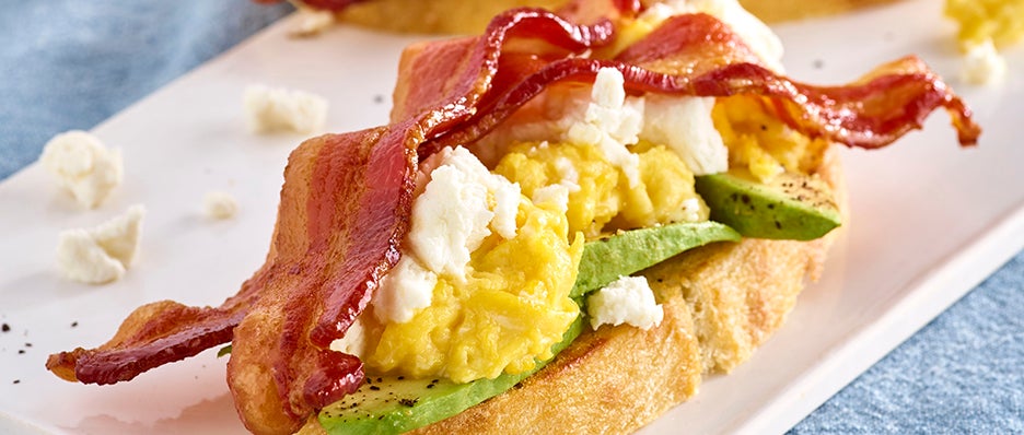 Avocado Toast with Bacon, Scrambled Eggs and Goat Cheese