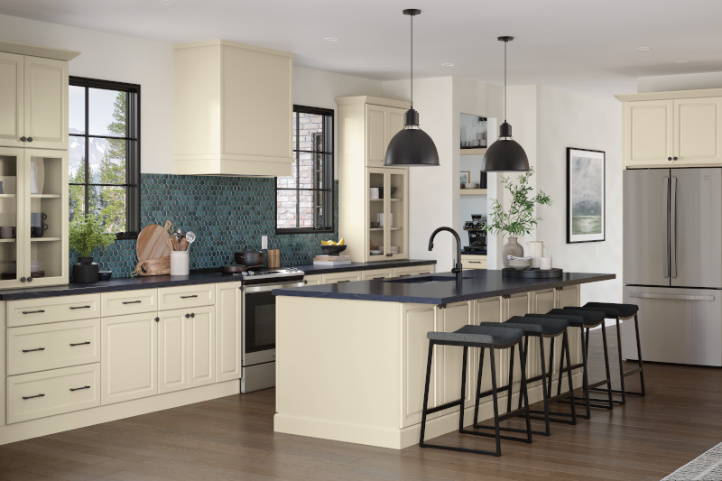 An off-white kitchen with accents of grey counters and turquoise backsplash. 