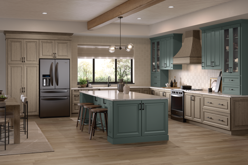 A kitchen with wood cabinets and an island displaying a variety of hardware, including knobs and drawer pulls.