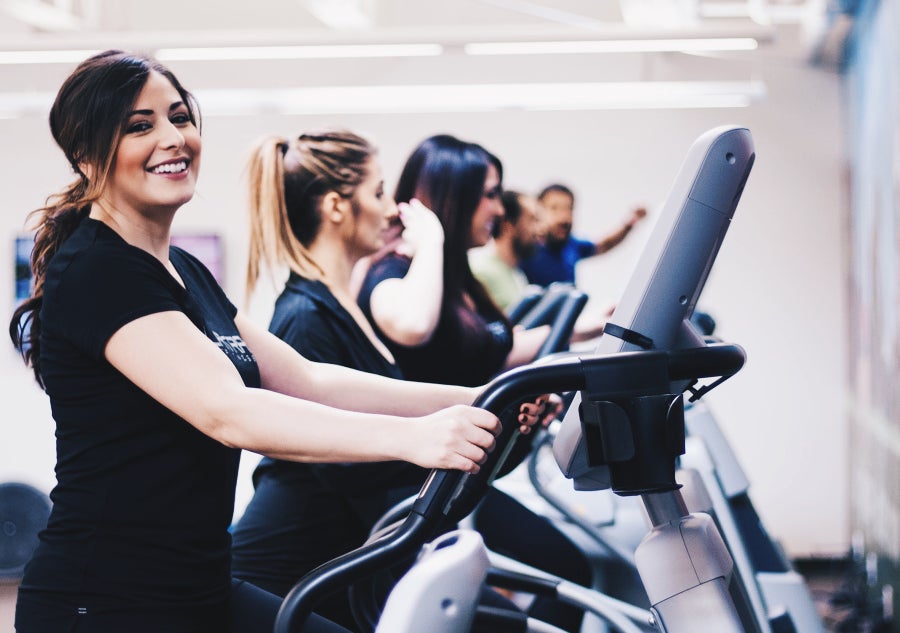 Woman on elliptical in fitness center