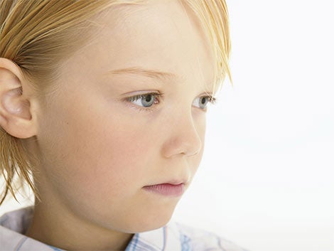 Blonde child looking away.