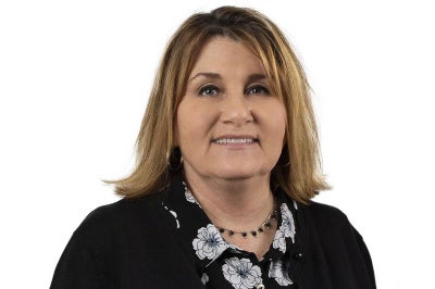 Woman in professional black jacket.