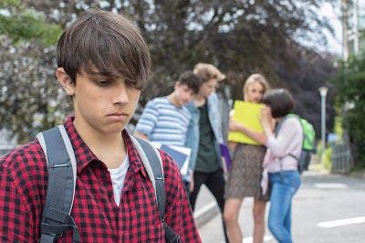 Young boy appears to feel left out as if bullied.