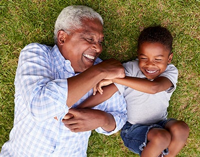 A grandad plays with his grandson.