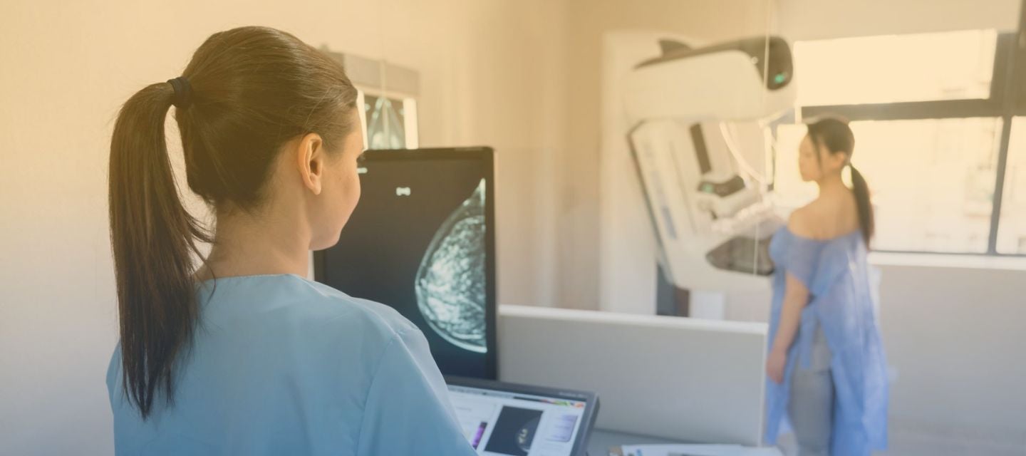 Mammography scan being performed