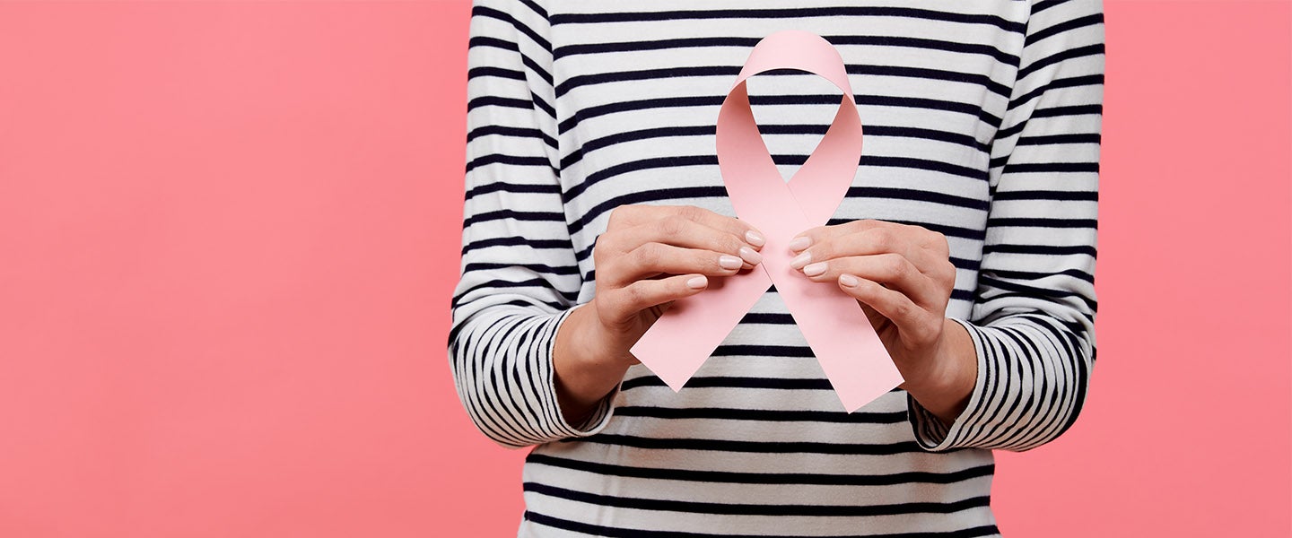 Woman holding large ribbon