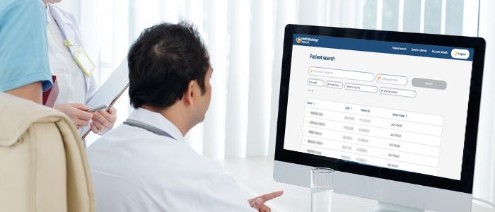 Doctor looking at I-MED Online screen