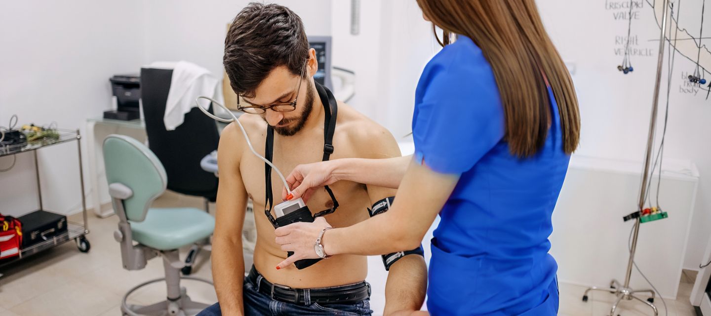 patient being set up with  24 hour holter monitoring device