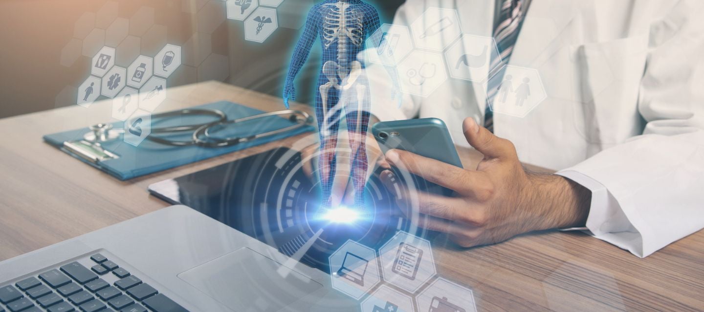 Image of doctor sitting at desk with graphic images overlayed