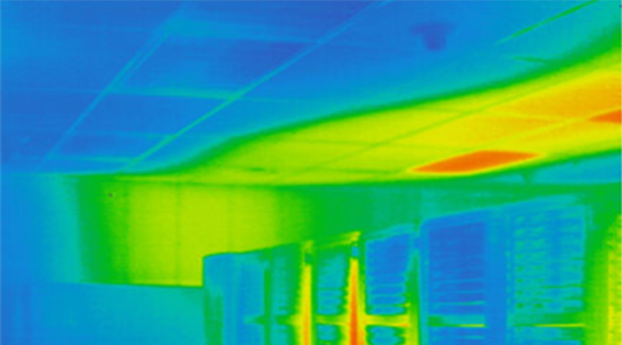 Thermal image showing temperature variations in a data center with hotspots near the ceiling.