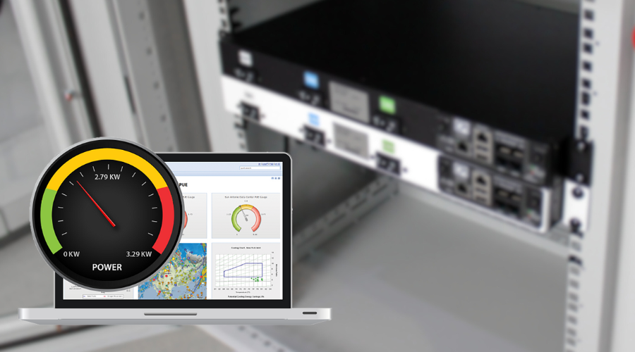 Close-up of a power distribution unit (PDU) in a cabinet with a laptop displaying energy monitoring software and a power usage gauge.