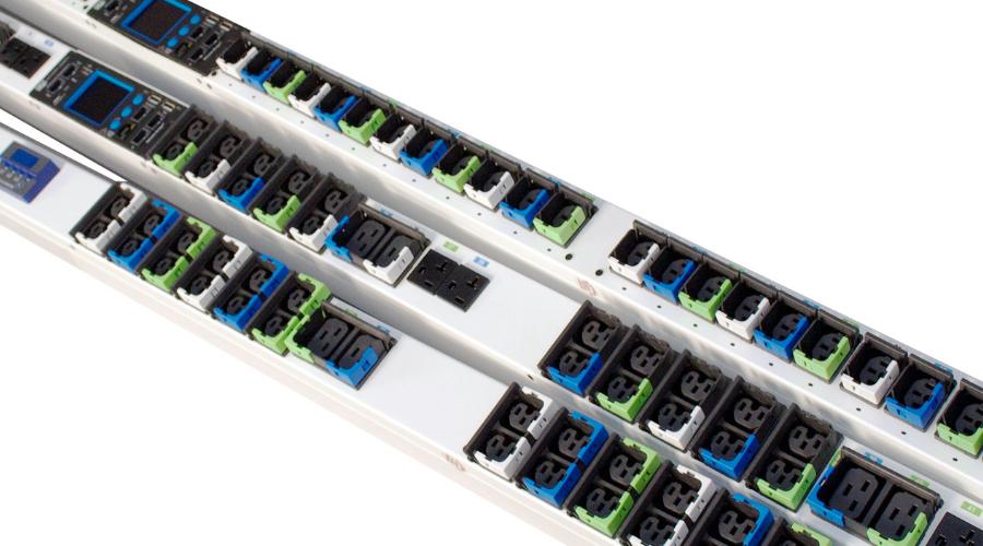 A close-up of high-power PDUs with color-coded locking outlets and integrated displays for advanced power management.