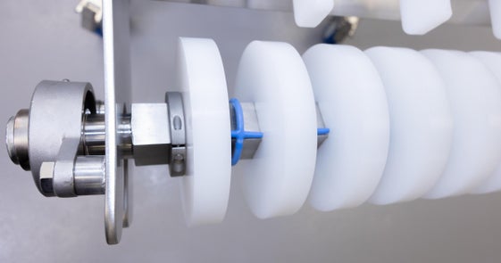 OneTrack support wheels on conveyor shaft