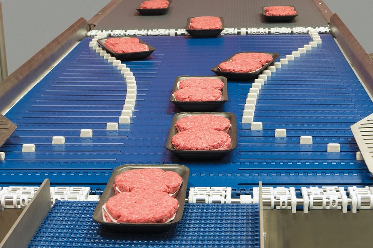 Steaks hachés crus sur un regroupeur AIM